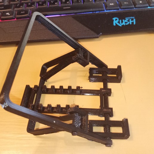 Download STL file universal phone holder Onepiece printing mechanism Holder Kitchen Table