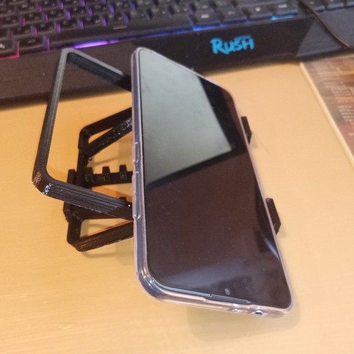 Download STL file universal phone holder Onepiece printing mechanism Holder Kitchen Table