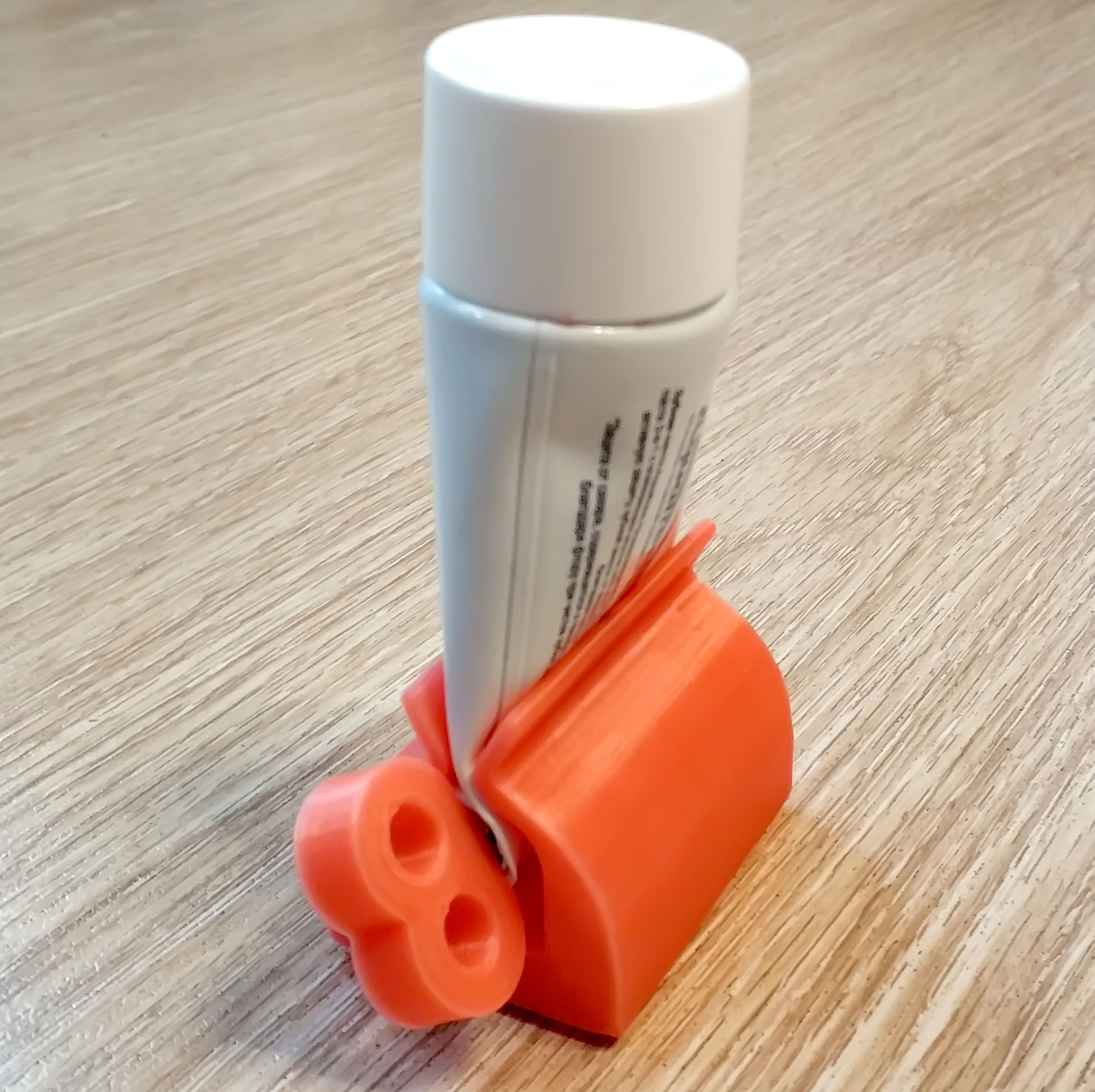 Toothpaste squeeze holder